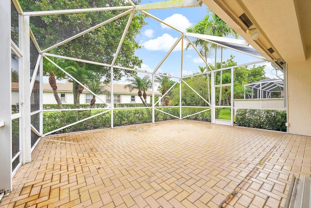 view of patio / terrace with a lanai