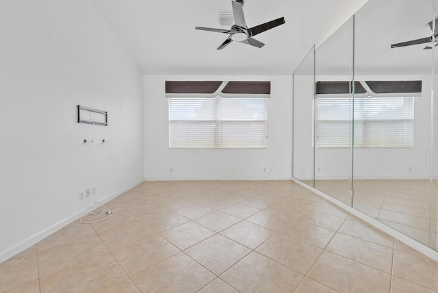 unfurnished bedroom featuring light tile patterned flooring, ceiling fan, and a closet