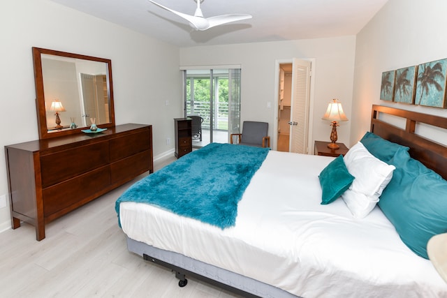 bedroom with access to exterior, light wood-type flooring, and ceiling fan