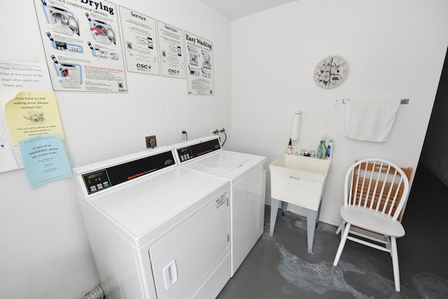 washroom with sink and separate washer and dryer