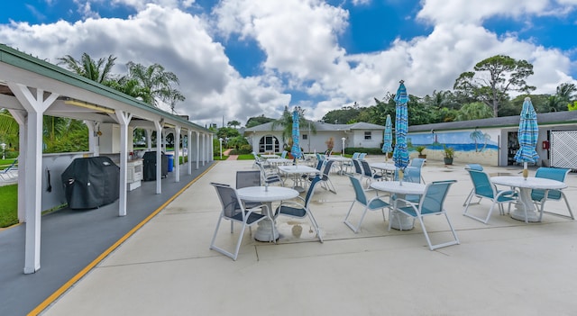 view of patio / terrace featuring a pool and grilling area