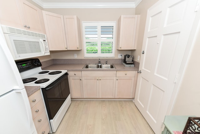 kitchen with white appliances, light hardwood / wood-style floors, sink, and crown molding