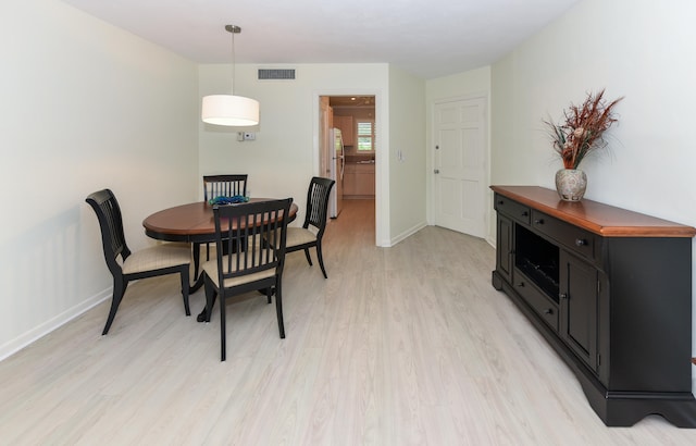 dining room featuring light hardwood / wood-style flooring