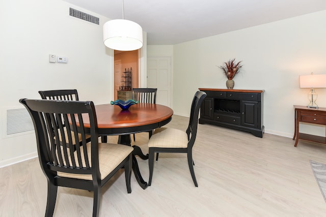 dining room with light hardwood / wood-style flooring