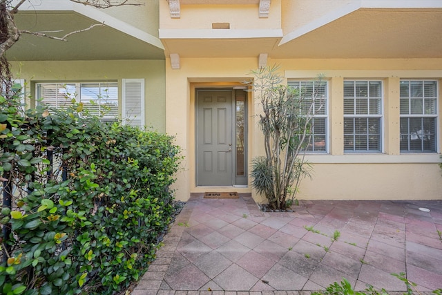 entrance to property with a patio