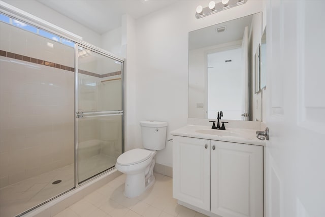 bathroom featuring walk in shower, tile patterned flooring, vanity, and toilet