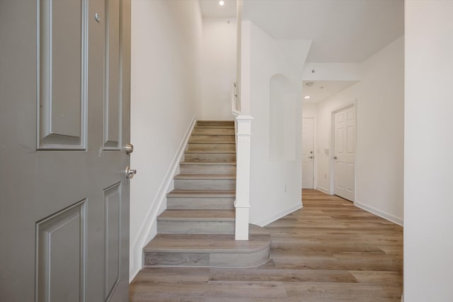 staircase featuring hardwood / wood-style flooring