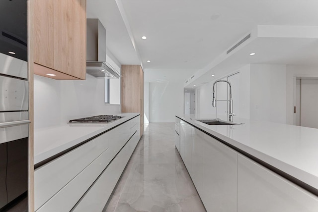 485 E Royal Palm Rd Unit 204, Boca Raton, FL 33432 - kitchen with modern cabinets, wall chimney range hood, a sink, stainless steel gas stovetop, and light marble finish floors