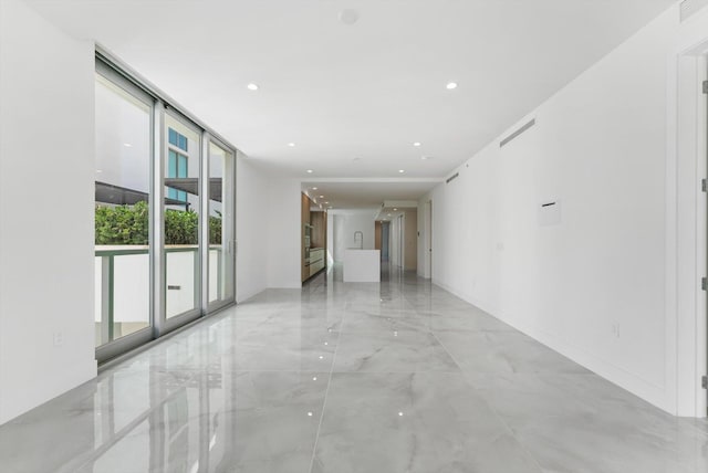 485 E Royal Palm Rd Unit 204, Boca Raton, FL 33432 - empty room with recessed lighting and light marble finish floors