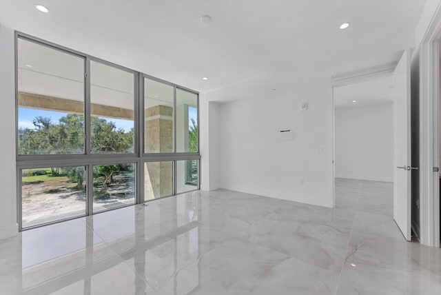 485 E Royal Palm Rd Unit 204, Boca Raton, FL 33432 - spare room featuring a wall of windows and recessed lighting