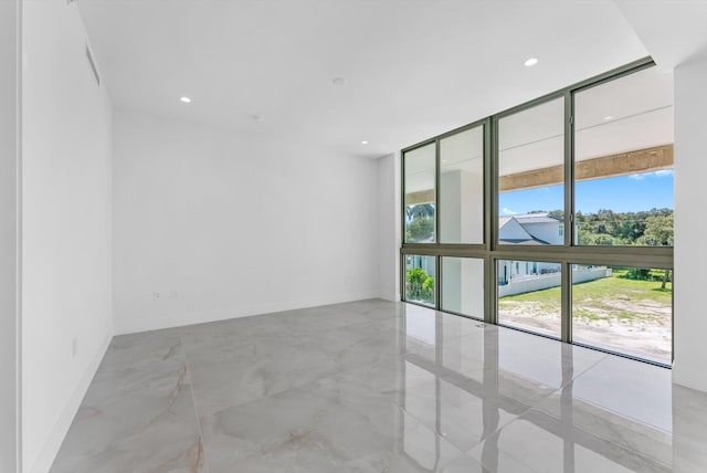 485 E Royal Palm Rd Unit 204, Boca Raton, FL 33432 - unfurnished room with expansive windows, marble tiled flooring, and recessed lighting