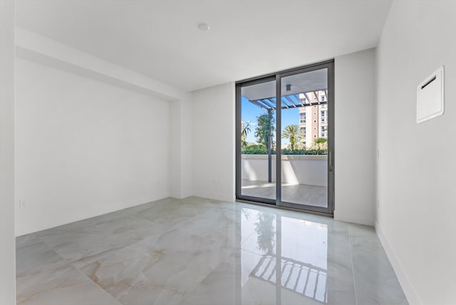 485 E Royal Palm Rd Unit 204, Boca Raton, FL 33432 - unfurnished room with floor to ceiling windows, marble finish floors, and baseboards