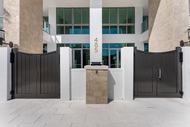 485 E Royal Palm Rd Unit 204, Boca Raton, FL 33432 - doorway to property with a gate and stucco siding
