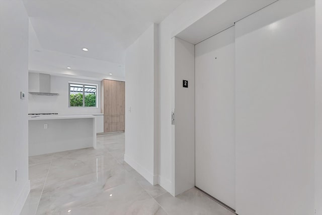 485 E Royal Palm Rd Unit 204, Boca Raton, FL 33432 - hallway with light marble finish floors, recessed lighting, and baseboards
