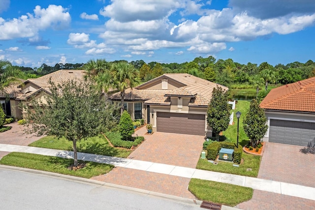 mediterranean / spanish-style home featuring a garage