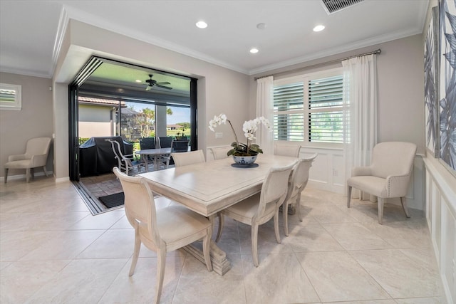 dining room featuring ornamental molding and ceiling fan