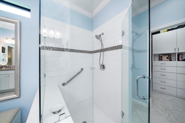 bathroom featuring ornamental molding, vanity, and an enclosed shower