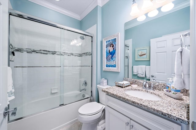 full bathroom featuring bath / shower combo with glass door, crown molding, vanity, and toilet