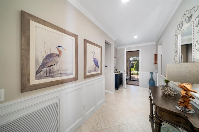 hallway featuring ornamental molding