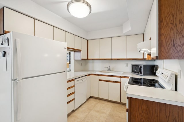 kitchen with white appliances, sink, white cabinetry, light tile patterned floors, and exhaust hood