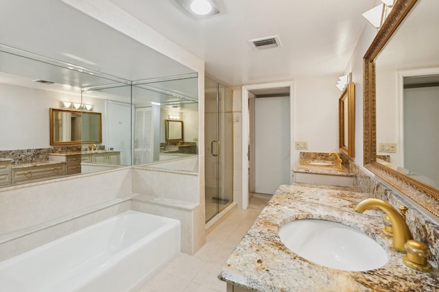 bathroom with vanity, independent shower and bath, and tile patterned flooring