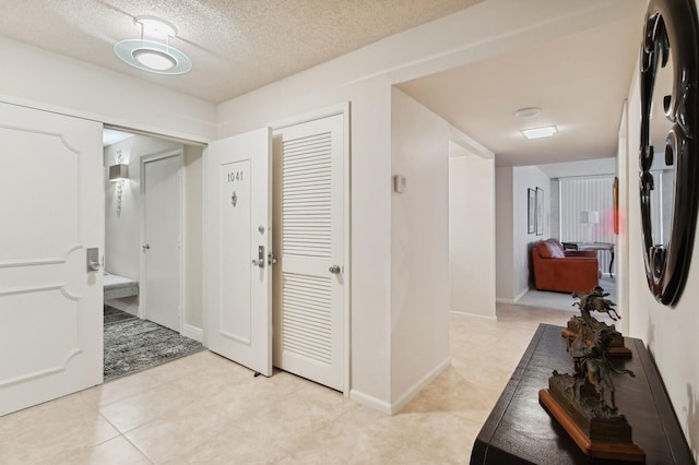 corridor with a textured ceiling