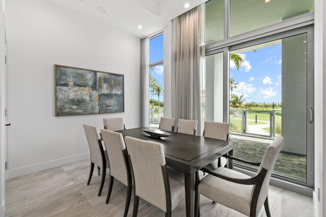 dining room featuring recessed lighting and baseboards