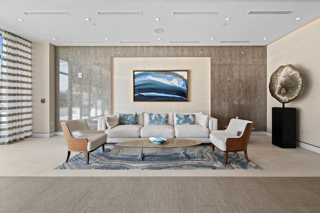 living room featuring baseboards and recessed lighting