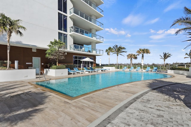 community pool with a patio area