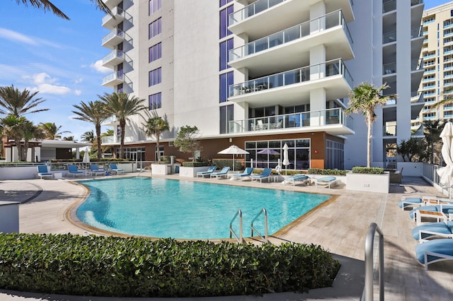 view of swimming pool with a patio