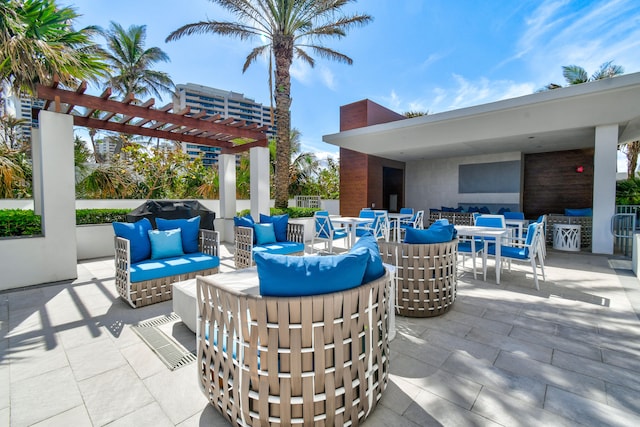 view of patio / terrace with an outdoor living space and a pergola