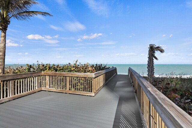 wooden terrace with a water view