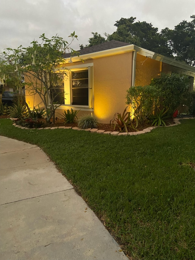 view of home's exterior featuring a yard