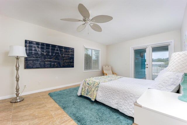 1121 SW Pine Tree Ln, Palm City, FL 34990 - bedroom featuring access to outside, baseboards, ceiling fan, and light tile patterned flooring
