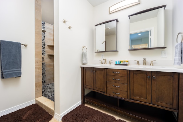 1121 SW Pine Tree Ln, Palm City, FL 34990 - full bath with a tile shower, double vanity, and baseboards