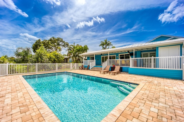 1121 SW Pine Tree Ln, Palm City, FL 34990 - view of pool featuring a ceiling fan, a patio, and fence