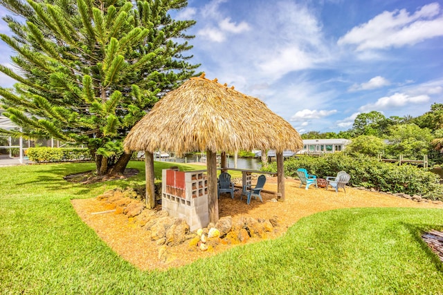 1121 SW Pine Tree Ln, Palm City, FL 34990 - surrounding community featuring a yard