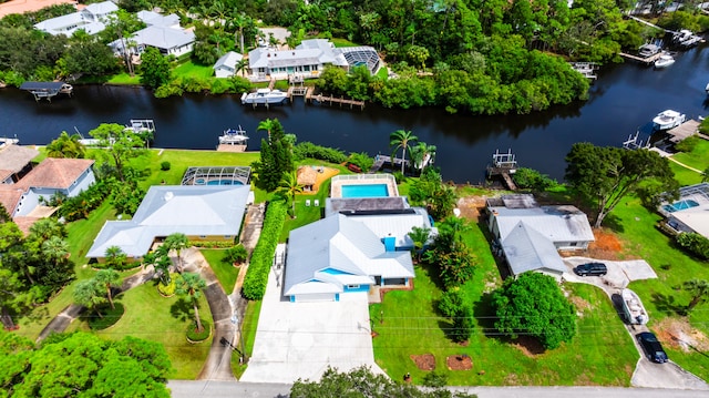 birds eye view of property with a residential view and a water view