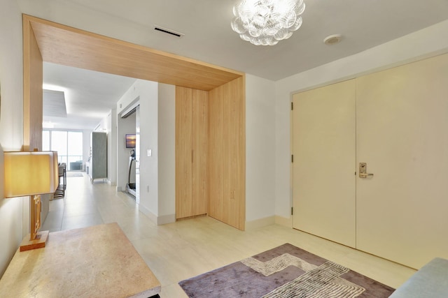 704 N Ocean Blvd Unit 602, Pompano Beach, FL 33062 - entrance foyer with a chandelier and baseboards