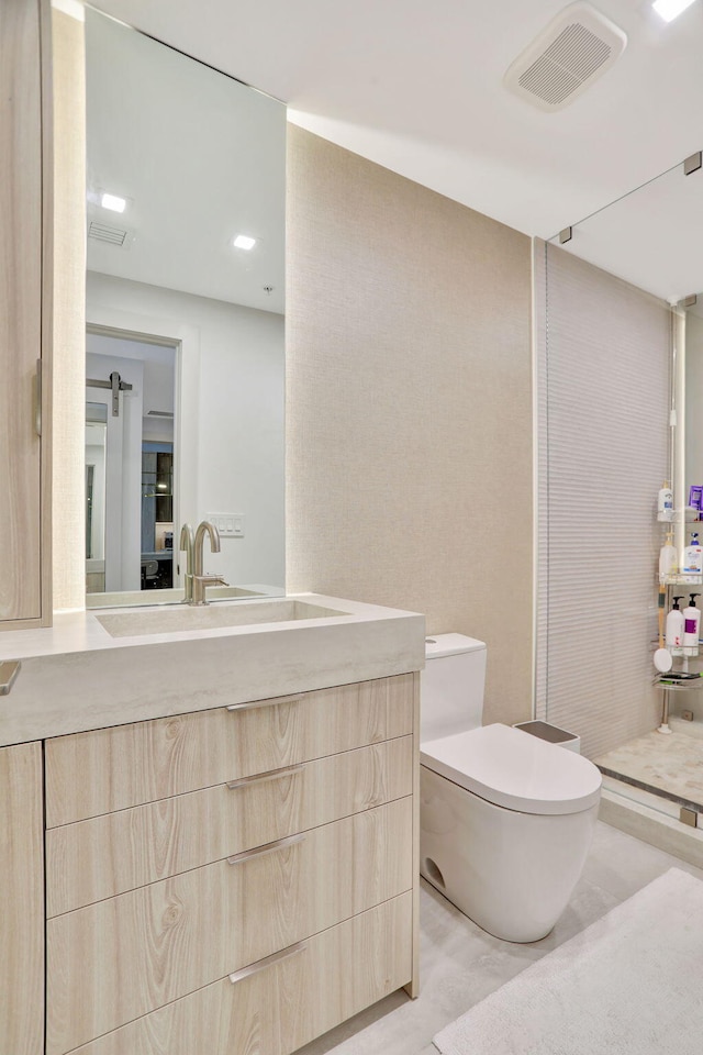 704 N Ocean Blvd Unit 602, Pompano Beach, FL 33062 - bathroom with toilet, vanity, and walk in shower