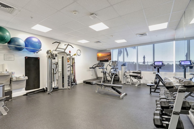 704 N Ocean Blvd Unit 602, Pompano Beach, FL 33062 - gym with a paneled ceiling and baseboards