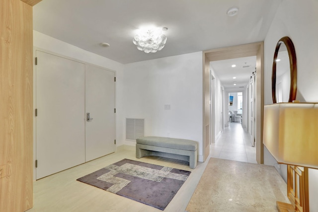 corridor with light hardwood / wood-style floors