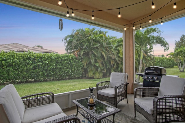 patio terrace at dusk featuring a yard, an outdoor living space, and a grill