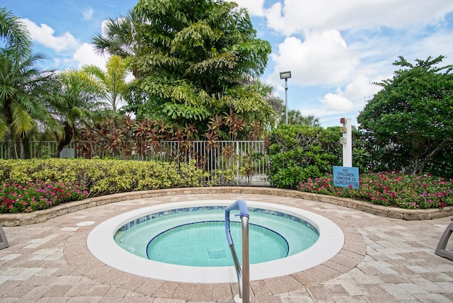 view of pool with a community hot tub