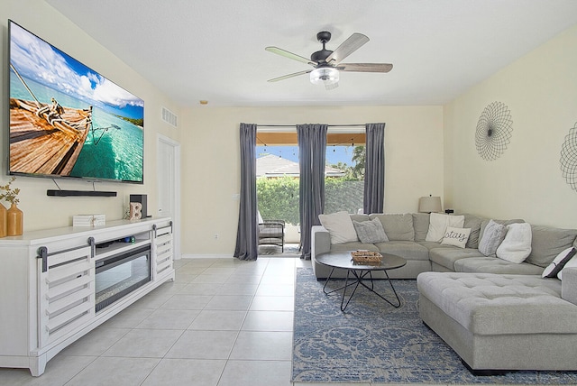 tiled living room featuring ceiling fan