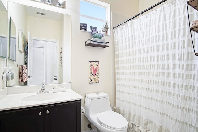 full bathroom with shower / tub combo, vanity, and toilet