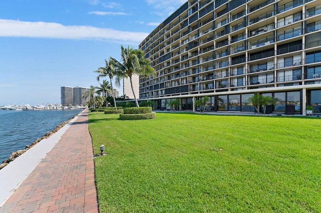 exterior space with a yard and a water view