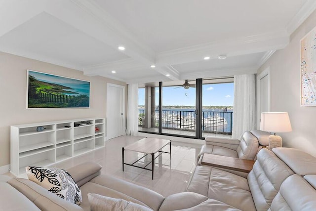 living room with ceiling fan, beam ceiling, a water view, and ornamental molding