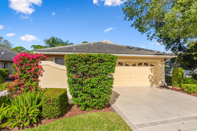 single story home featuring a garage