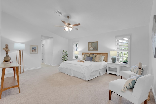 bedroom featuring vaulted ceiling, ceiling fan, and light colored carpet